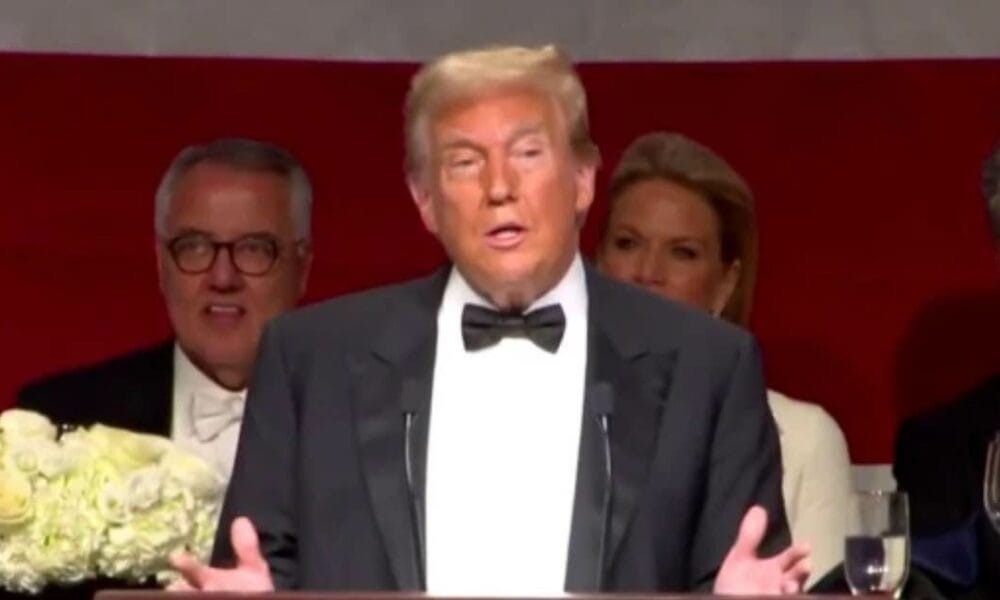 Donald Trump delivering a speech at the Al Smith dinner, entertaining the crowd with humor and sharp remarks.