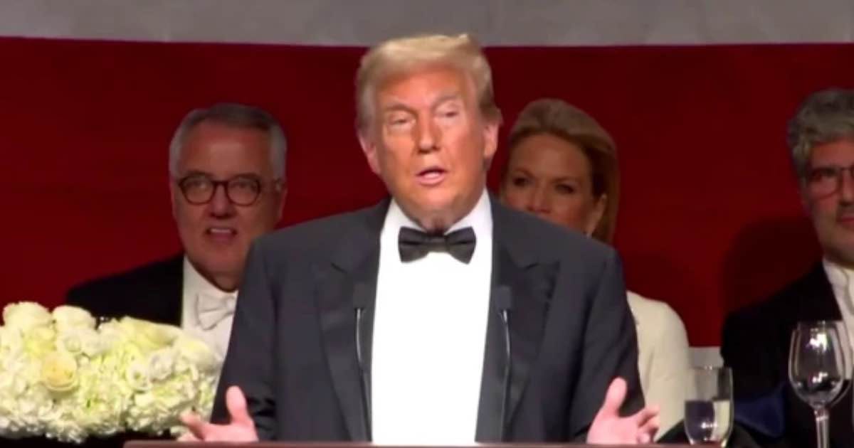 Donald Trump delivering a speech at the Al Smith dinner, entertaining the crowd with humor and sharp remarks.